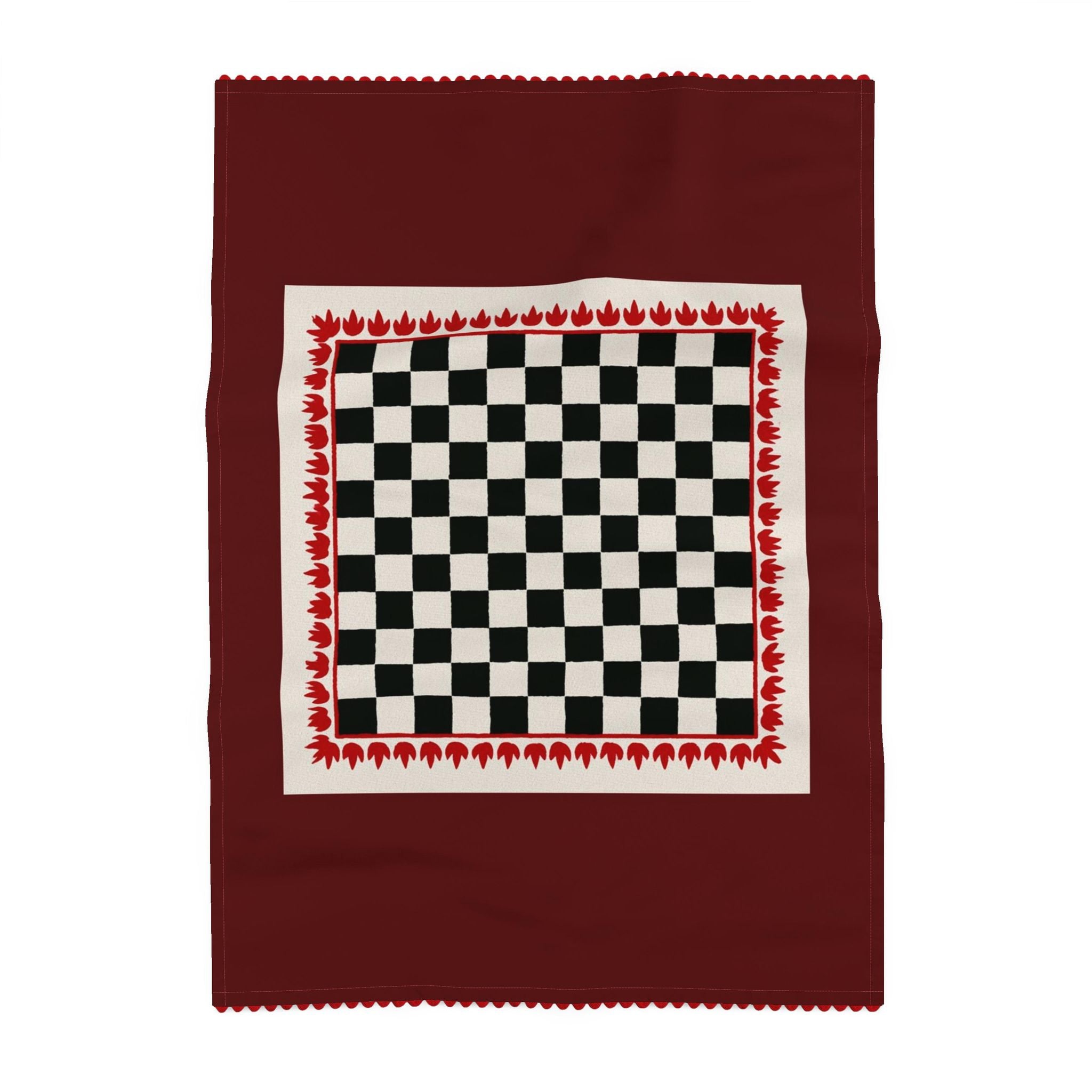 A square burgundy scarf with a central cream-colored panel featuring a black and white checkerboard pattern, bordered by a red flame-like pattern.