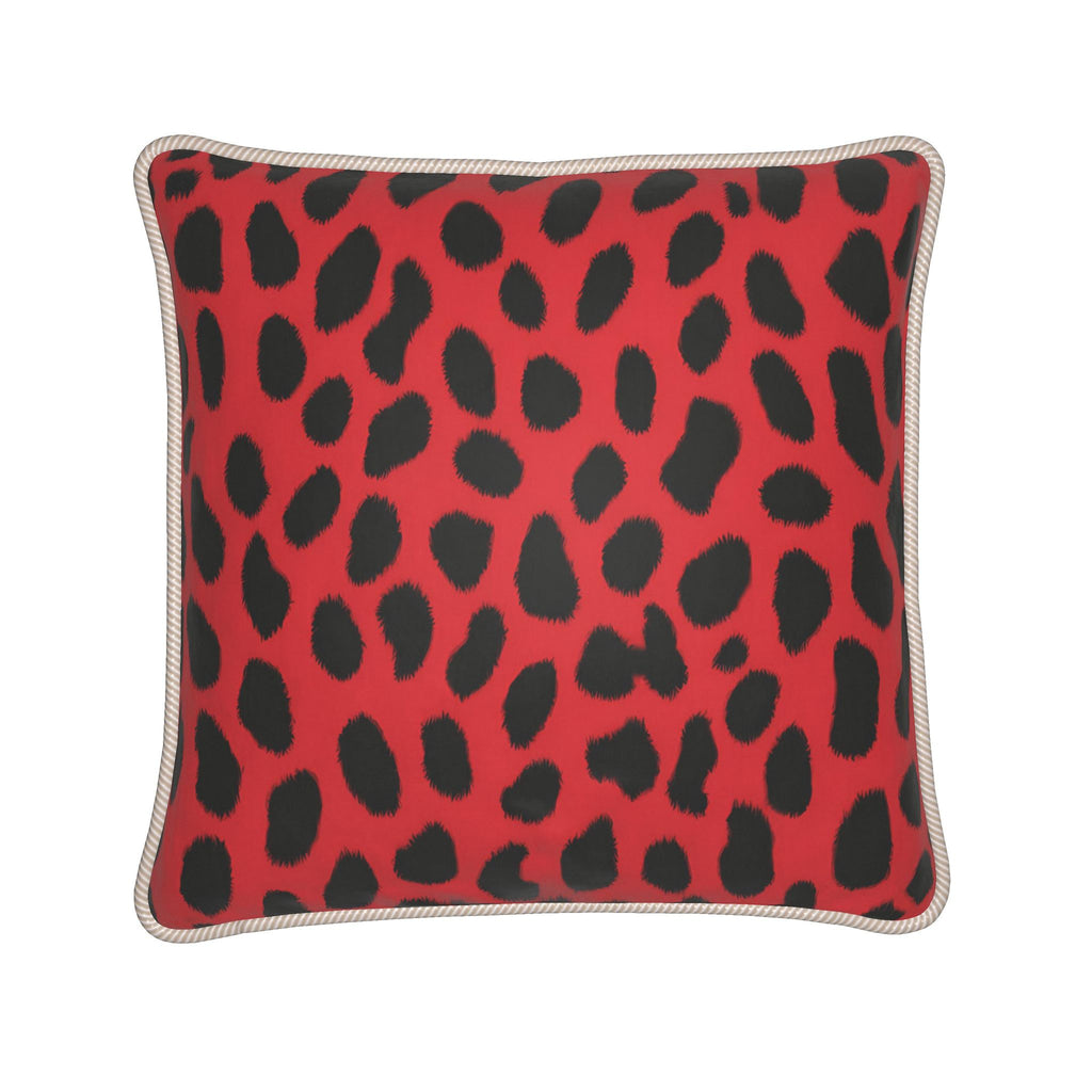 A square throw pillow featuring a red and black leopard print pattern, finished with a beige braided rope trim along the edges, shown against a plain white background.