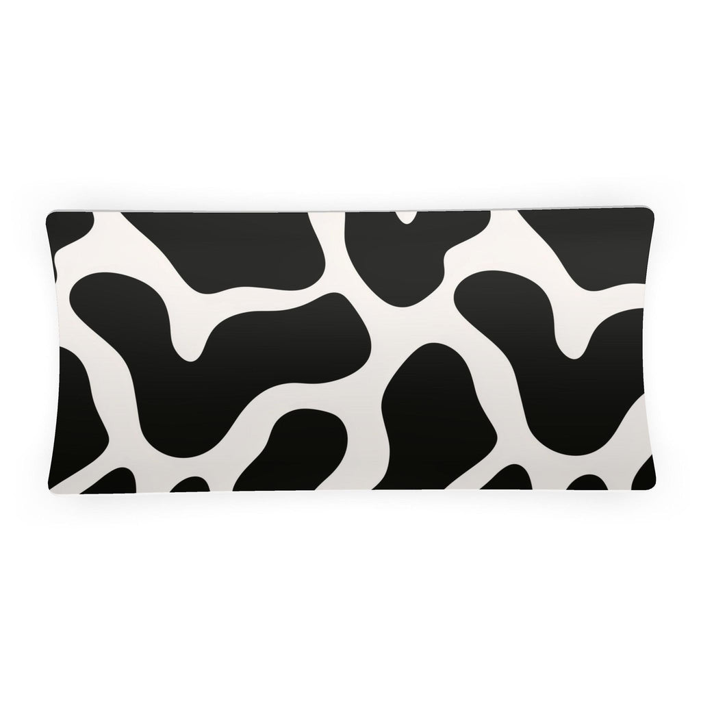A rectangular sedar dish featuring a bold black and white organic cow-print pattern, shown against a plain white background.