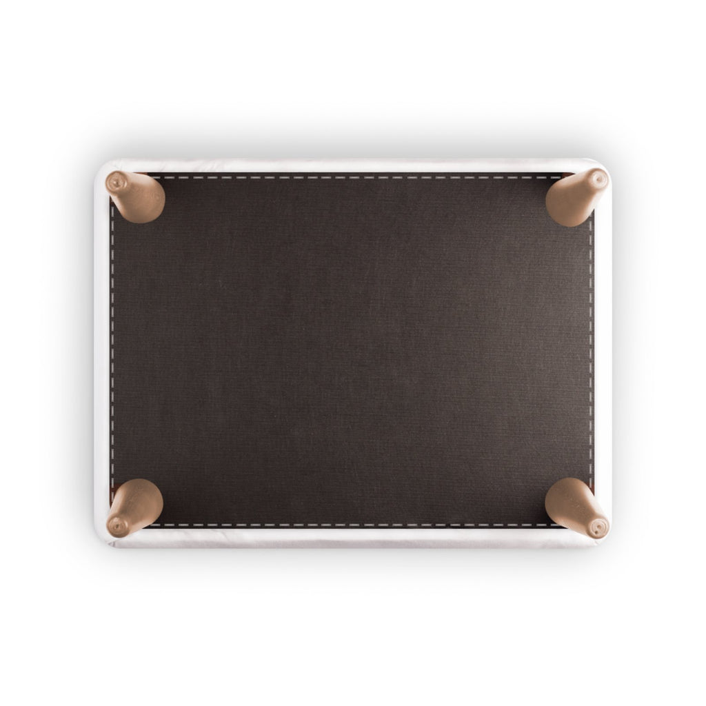Top-down view of a rectangular dark brown leather pad or mat with a white border and four metallic rose gold corner protectors, shown on a white background.