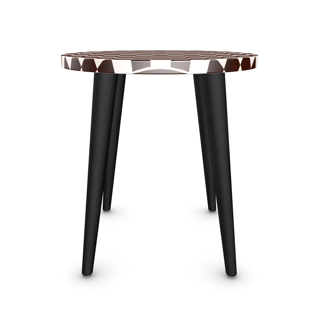 A modern side table with a round top featuring a brown and white geometric pattern, supported by three black tapered legs, shown on a plain white background.